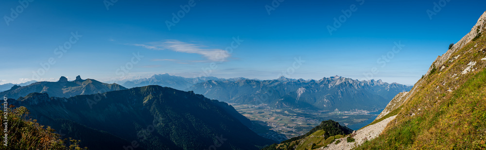Panorama of the mountains, clouds and lake. Landscape of Rochers de Naye, Montreux, Switzerland in summer.