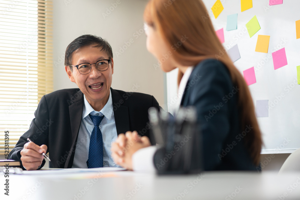 Business partnership concept, Senior in business is explaining and discussing project with partner