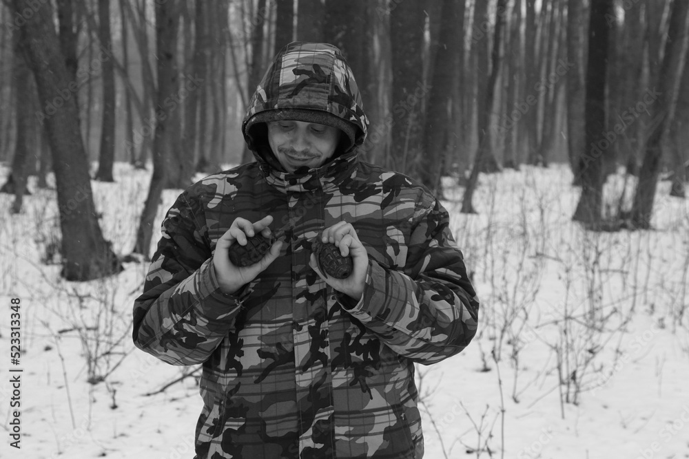 A soldier holding a grenade