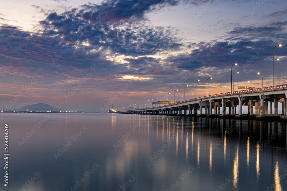 Sunrise shoot under the Penang Bridge. Penang bridges are crossings over the Penang Strait in Malaysia. They connect the area of Seberang Perai on the Malay peninsula with the island of Penang.