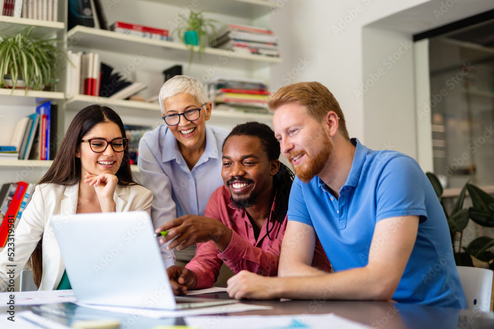 Group of successful happy multiethnic business people working as a team in office on meeting. Group of successful happy multiethnic business people working as a team in office on meeting.