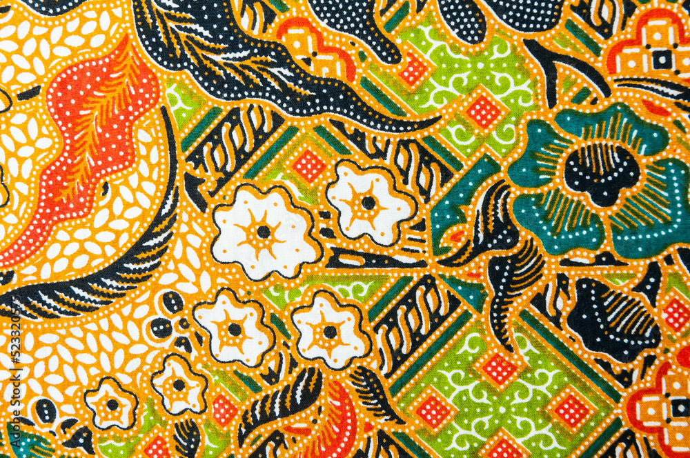 Closeup flower on batik sarong pattern background in Thailand