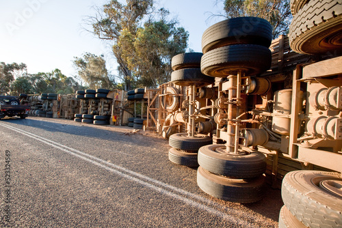 Truck accident with truck overturned on highway photo