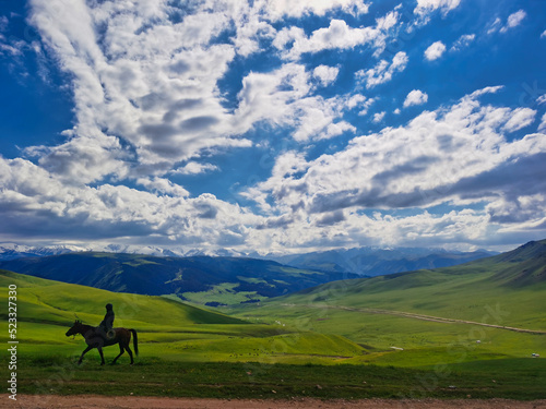 Kazakh farmer on his horse in the mountains, Almaty region.  © Franck