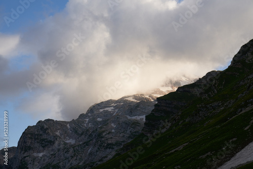 mountains with glacier in nepal and clouds on the peaks. mountain climbing