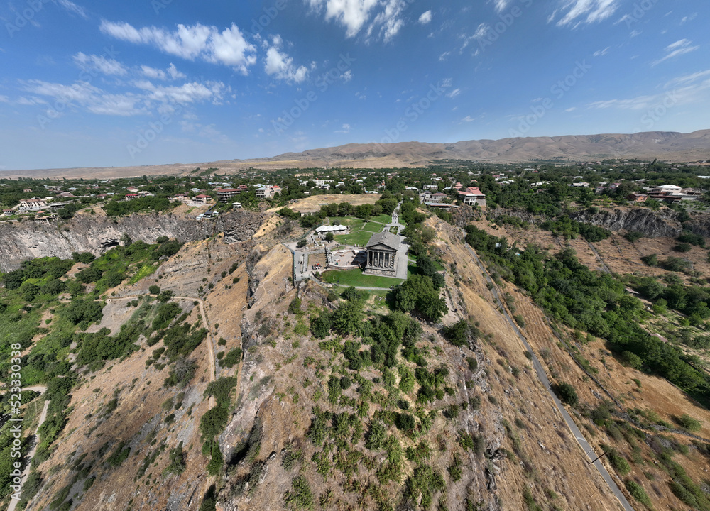 panoramic view of a mountain landscape with an old Christian church against the sky in Armenia taken from a drone