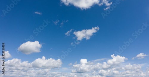Photo of blue sky with white clouds © Gray wall studio