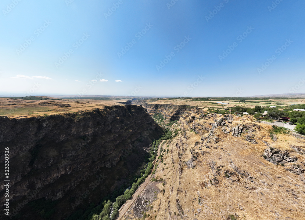 panoramic view of a mountain landscape with a gorge against the sky in Armenia taken from a drone