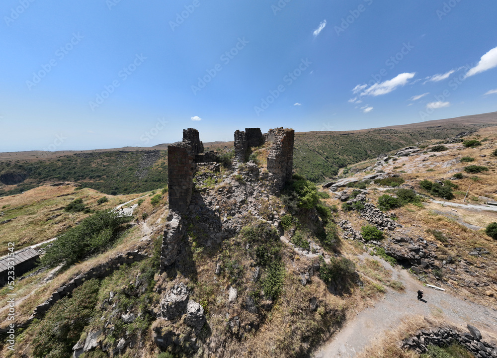 panoramic view of a mountain landscape with ancient stone buildings in Armenia taken from a drone