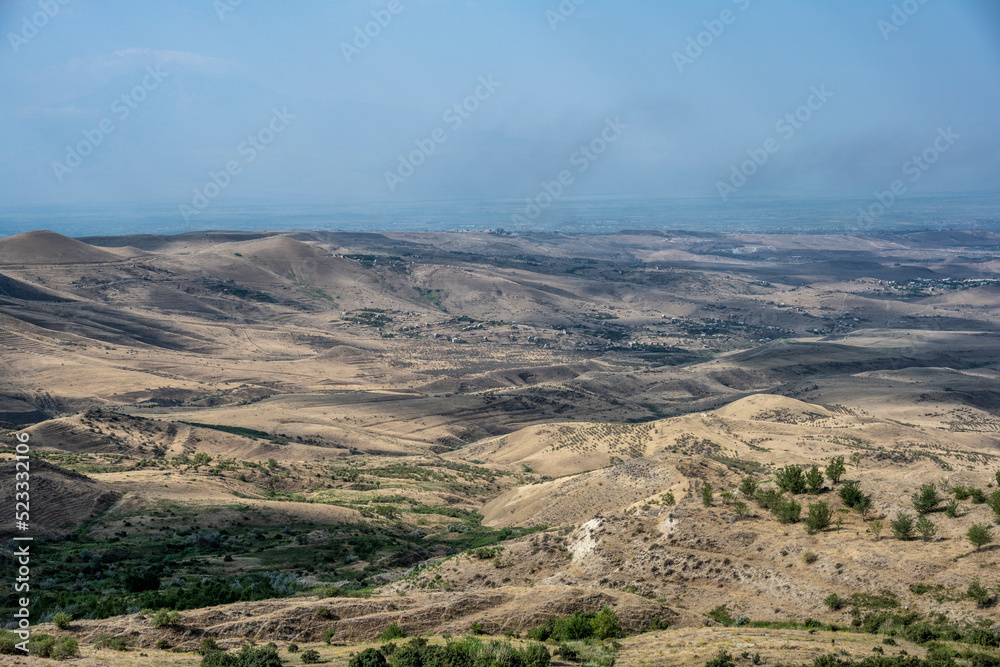 panoramic view of a mountain landscape with valleys against the sky in Armenia taken from a drone