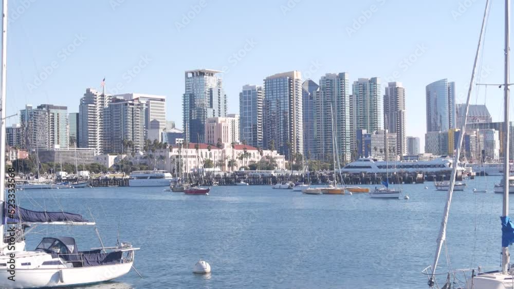 Yachts in marina and downtown city skyline, San Diego cityscape, California coast, USA. Highrise skyscrapers and boat in bay, waterfront harborside promenade. Urban architecture and sailboat in harbor Yachts in marina and downtown city skyline, San Diego cityscape, California coast, USA. Highrise skyscrapers and boat in bay, waterfront harborside promenade. Urban architecture and sailboat in harbor