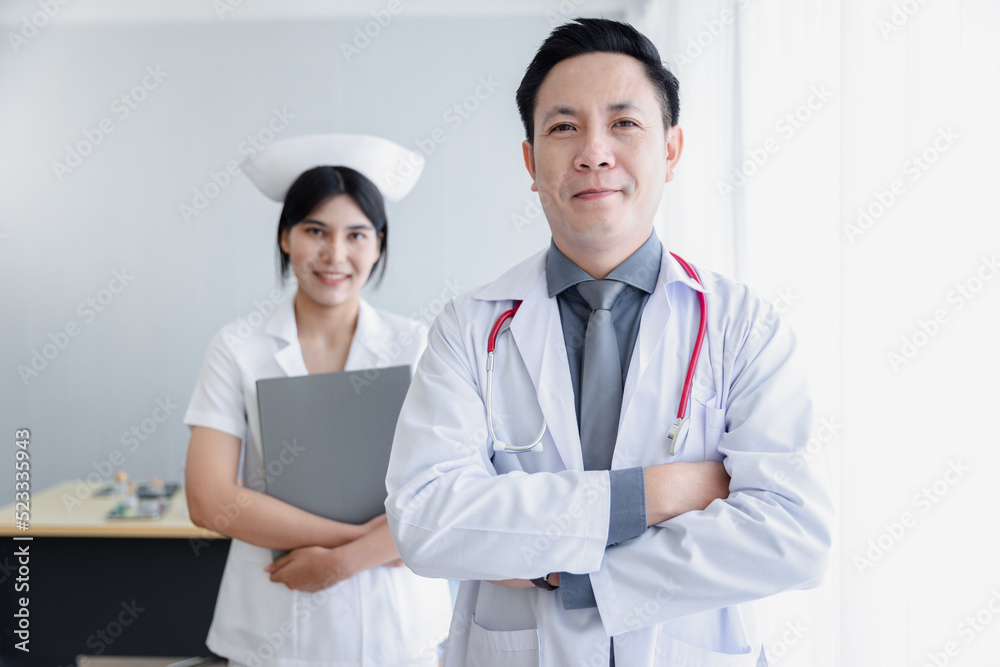 Portrait of asian mid-adult male doctor and nurse healthcare professionals at hospital Portrait of asian mid-adult male doctor and nurse healthcare professionals at hospital