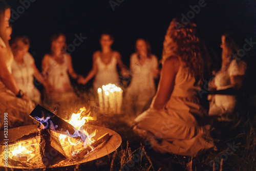Slika na platnu Women at the night ceremony. Ceremony space.
