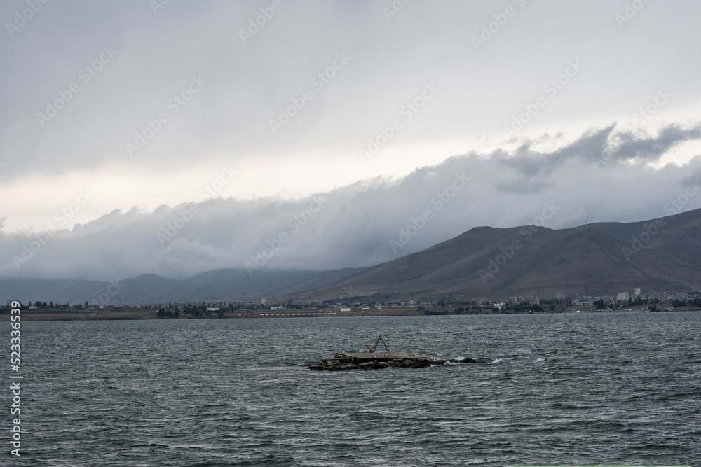 landscape with views of Lake Sevan and mountains and clouds on a summer day in Armenia