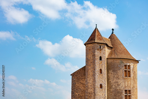 Beautiful view of medieval castle square towers over blue sky