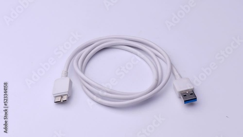 USB wire close-up on a white background, video electronics.