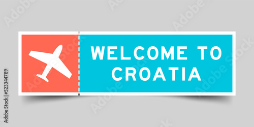 Orange and blue color ticket with plane icon and word welcome to croaita on gray background