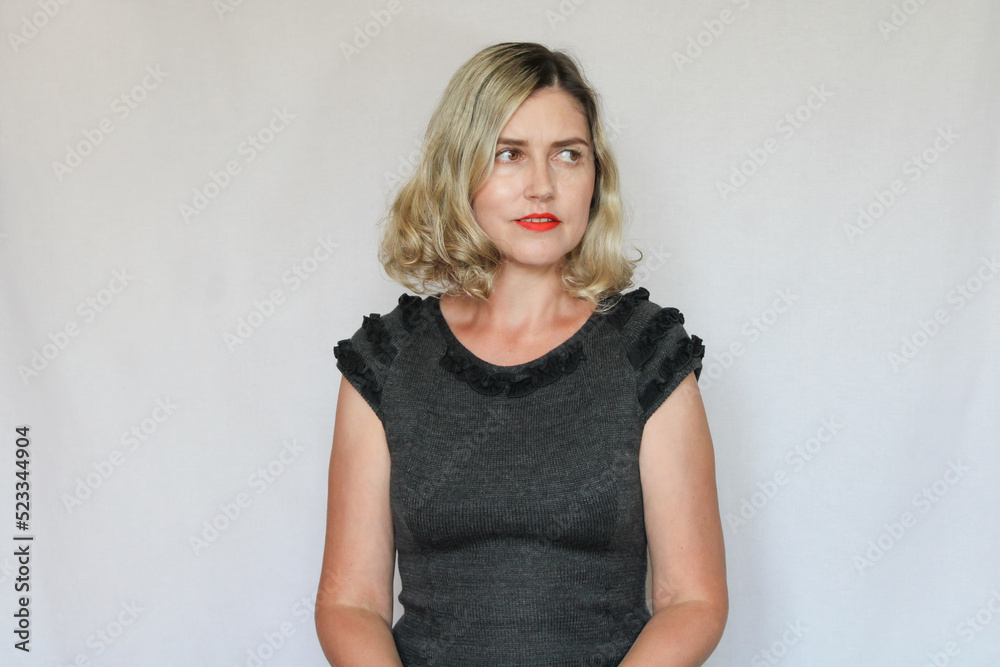 Beautiful middle-aged blond woman on a white background Beautiful middle-aged blond woman on a white background