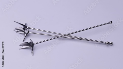 Cocktail sticks close-up on a white background, video of kitchen accessories.