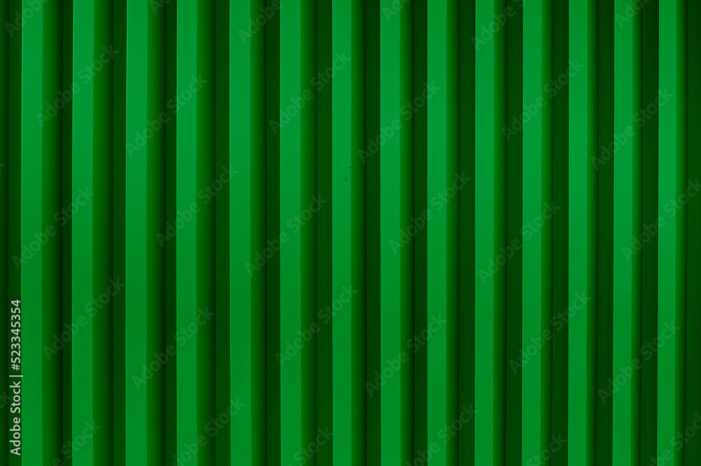 Background of green vertical metal strips.