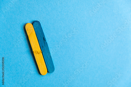 broken flag of ukraine on a blue background