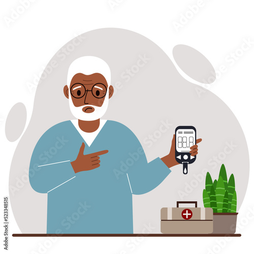 Sad old man holds a glucometer in his hand. The concept of blood sugar control, diabetic.