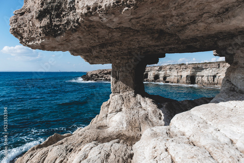 Hole in a cave with a beautiful view on sea near cape Greco in national park