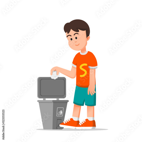 a boy throws paper in the trash