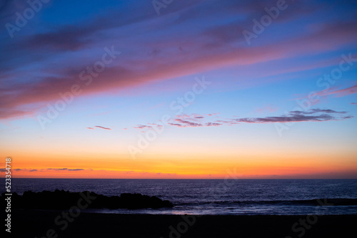 Sunset time over the sea with dramatic clouds.