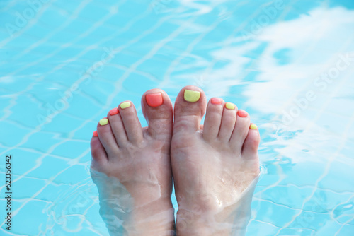 feet with bright pedicure
