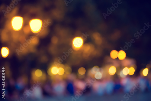 Blurred abstract urban background with street lights in bokeh shape © Igor Kapustin