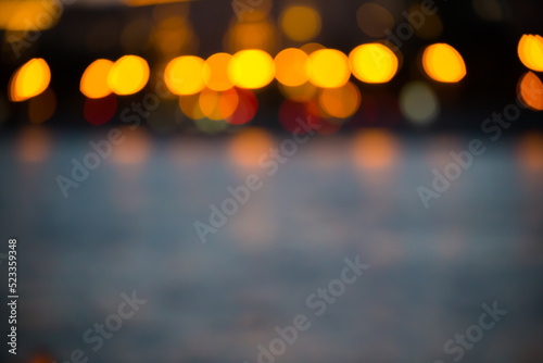Blurred abstract urban background with street lights in bokeh shape © Igor Kapustin