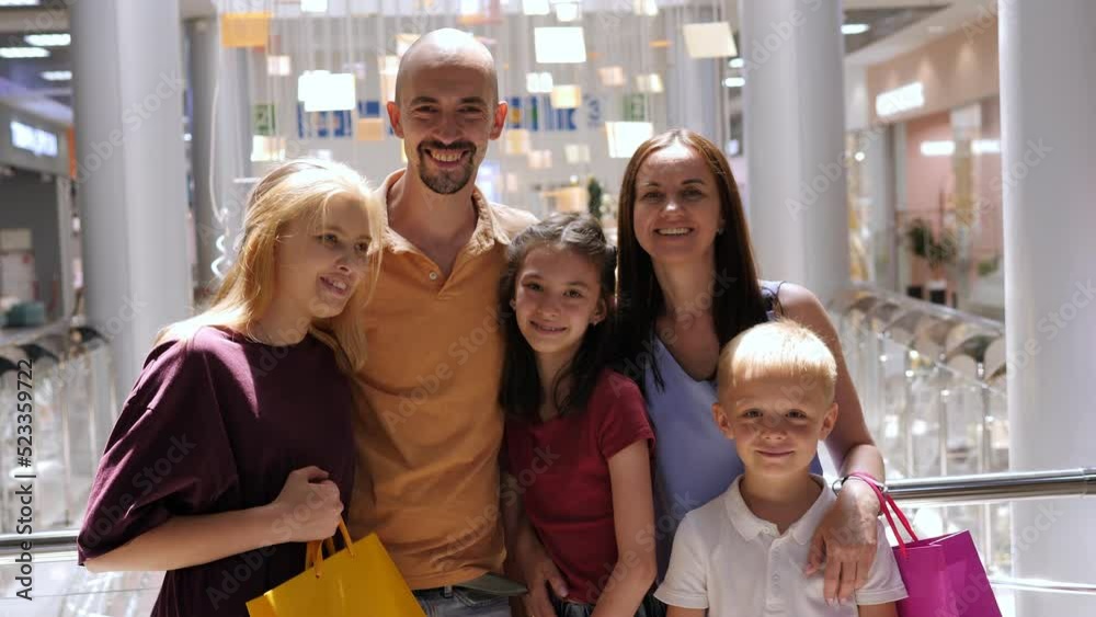 Portrait of a big happy family in a shopping mall with shopping bags. Portrait of a big happy family in a shopping mall with shopping bags.