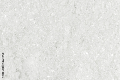 White kitchen salt. Top view, full frame photo.