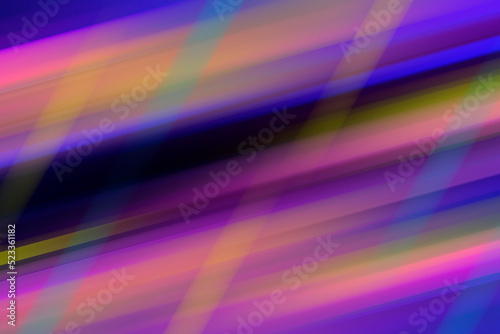 Abstract night background, blurred bokeh light. Multi colored neon lights on dark city street, reflection of neon light. Night view.
