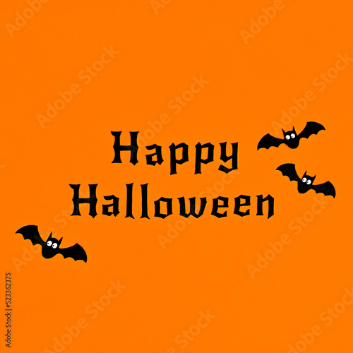 Simple minimal Happy Halloween greeting card with text and bats on orange background. Flat lay