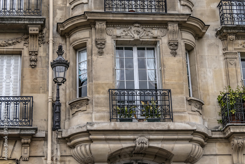 Traditional old French house: balconies and windows. Paris, France. photo