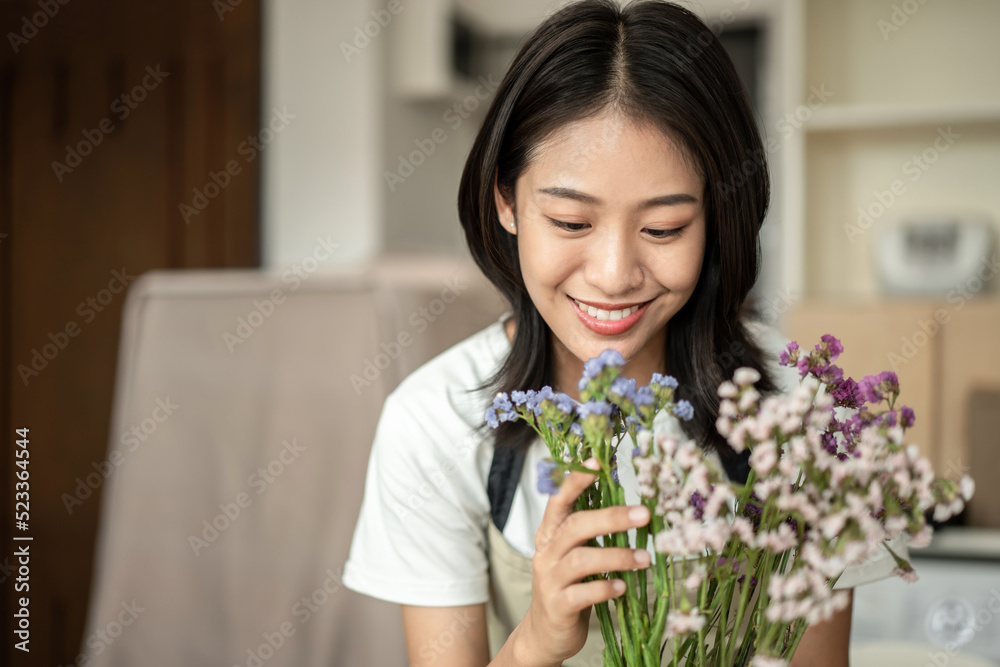 Weekend with her hobbies, Asian woman arranges a bouquet of flowers to decorate her home and beautify, Artificial flower arrangement, living room decoration ideas, Flowers bunch, Arts and crafts Weekend with her hobbies, Asian woman arranges a bouquet of flowers to decorate her home and beautify, Artificial flower arrangement, living room decoration ideas, Flowers bunch, Arts and crafts