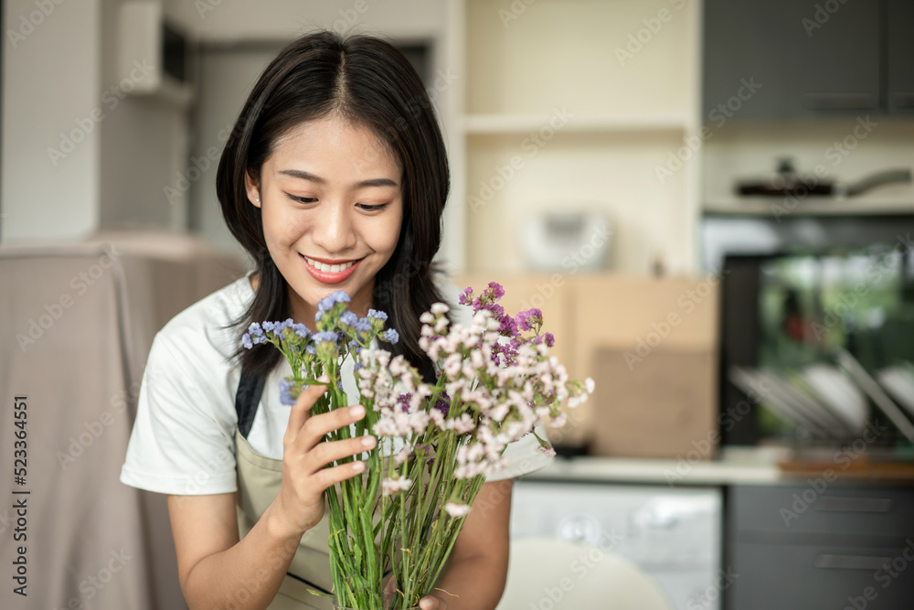 Weekend with her hobbies, Asian woman arranges a bouquet of flowers to decorate her home and beautify, Artificial flower arrangement, living room decoration ideas, Flowers bunch, Arts and crafts Weekend with her hobbies, Asian woman arranges a bouquet of flowers to decorate her home and beautify, Artificial flower arrangement, living room decoration ideas, Flowers bunch, Arts and crafts