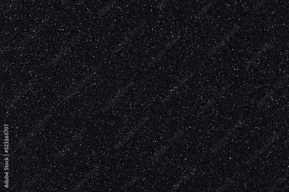 Dark black monochrome handmade glitter texture background, sparkling shiny wrapping paper for Christmas holiday seasonal wallpaper decoration, greeting and winter Christmas design element.