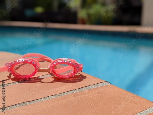 Goggles by pool photo