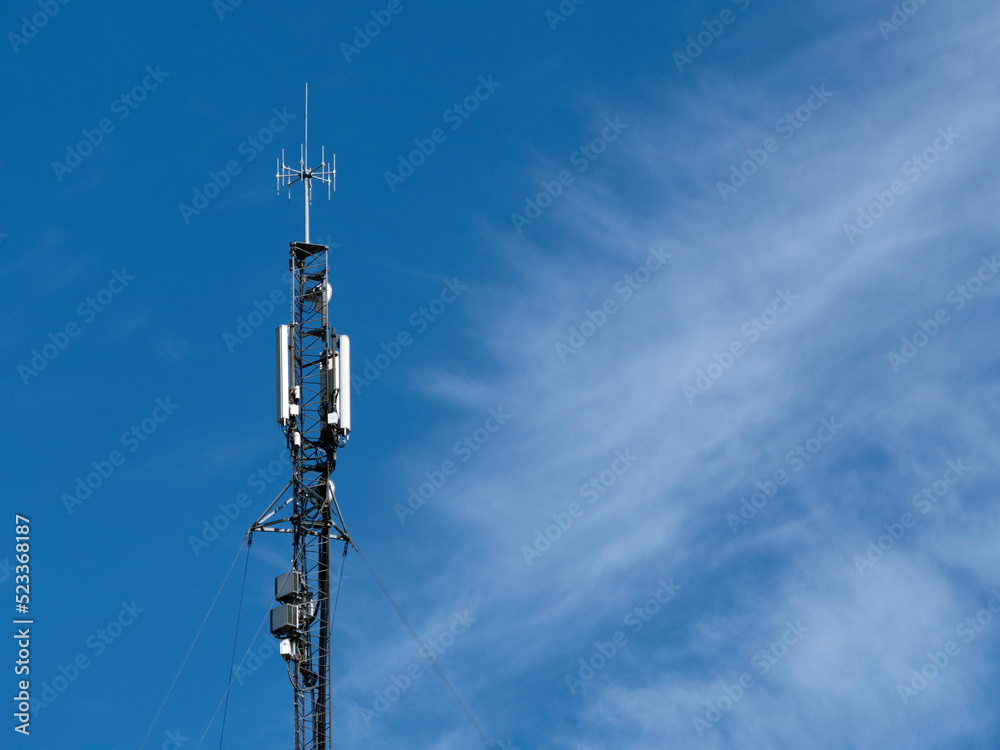 Communication antenna on a blue sky background Communication antenna on a blue sky background