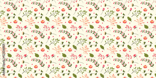 Patterns of elegant floral patterns in various colors, including tulips, and hibiscus flowers. Green, orange leaves and branches, scattered, seamless, light yellow background.