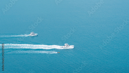 yachts sailing on the sea, top view
