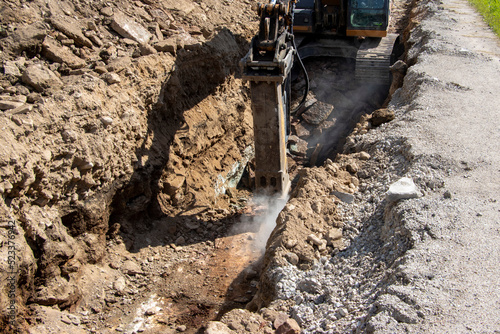 Wallpaper Mural Limestone trench.. CRAWLER EXCAVATOR Works on digging the Trench . Limestone hammering Torontodigital.ca