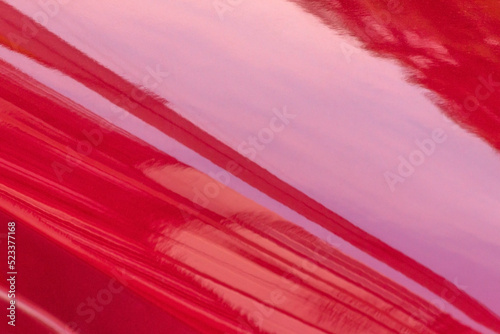 polished hood of luxury red car