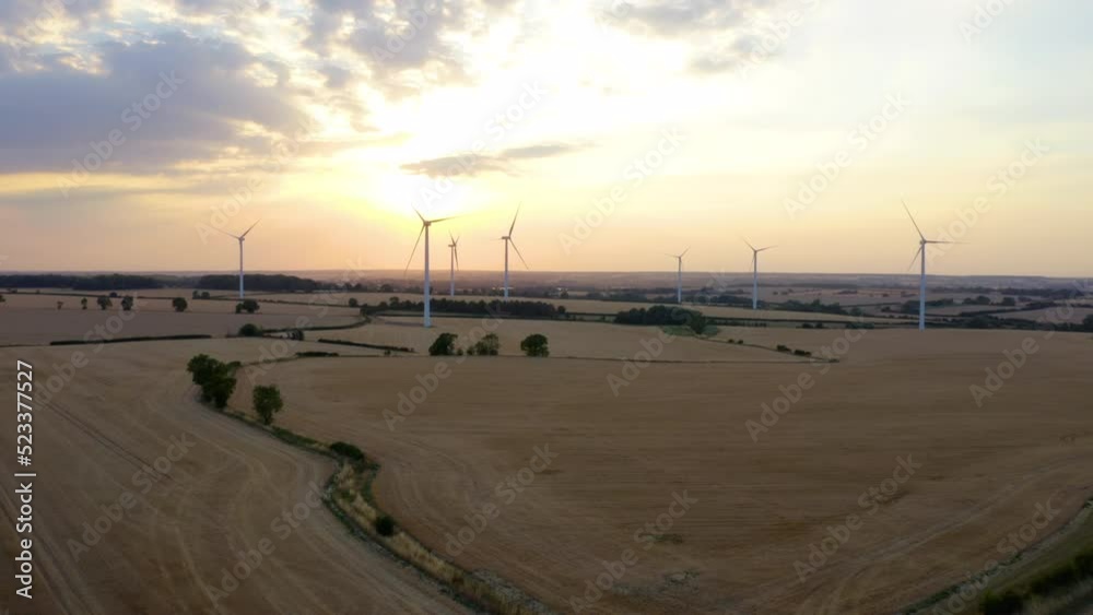 The wind turbine is not spinning. energy producing wind turbines. Wind turbines farm silhouettes. The wind turbine is not spinning. energy producing wind turbines. Wind turbines farm silhouettes.