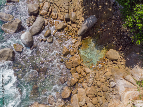 Aerial view from drone of Machabee Rock Pool at Mahé Island taken in the morning light