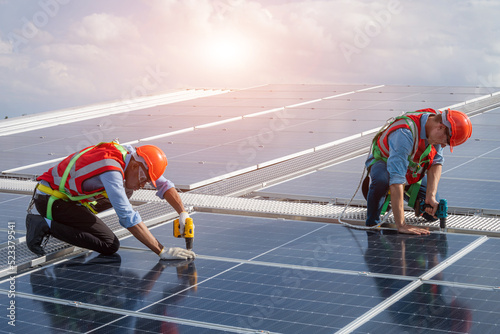 Wallpaper Mural Electrical and instrument technician installation and maintenance electric system solar panel on the roof of factory,Service check installation solar cell. Torontodigital.ca