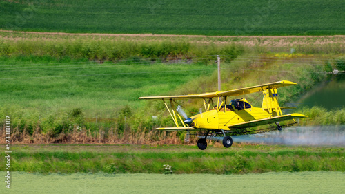 Spectacular yellow crop duster sprays fields of Eastern Washington